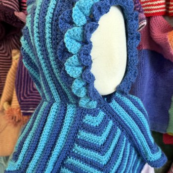 Crocheted Story Snuggler with frilled hood detail