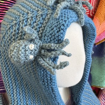 Story Snuggler with small octopus characters on hood