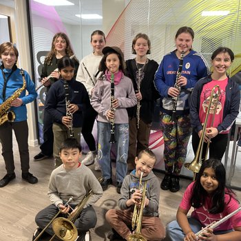 A group of children holding instruments