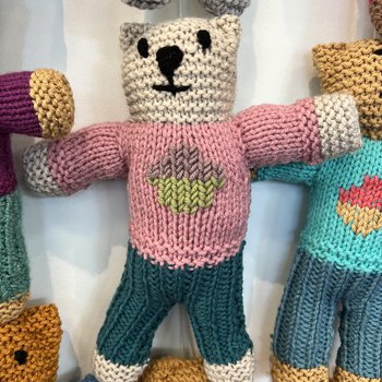 A hand knitted Brave Bear with a dusky pink jumper