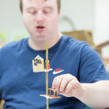 Photo of a young man making a story bottle