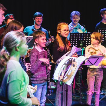 A group of children playing instruments