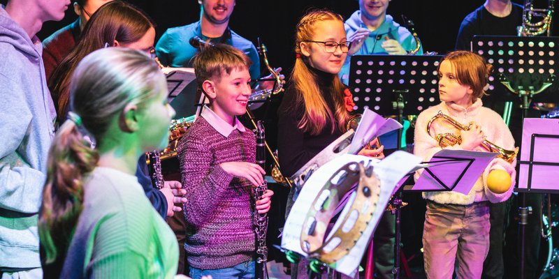 A group of children playing instruments