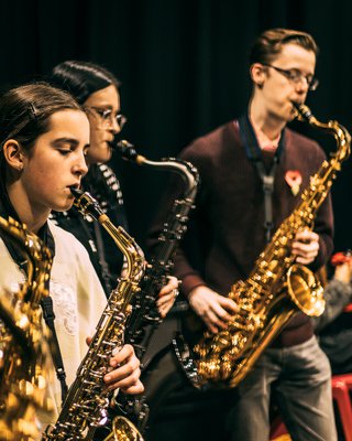 Trio of young Red Hot Band musicians performing on stage at The Old Library Mansfield November 2023