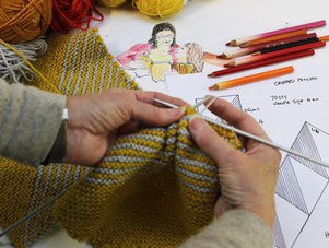 Close up image of hands knitting