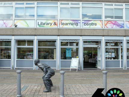Exterior of Kirkby Library and Learning Centre with 60th birthday badge