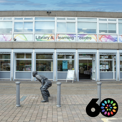 Exterior of Kirkby Library and Learning Centre with 60th birthday badge