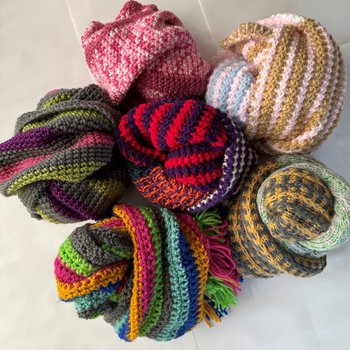 Bundles of beautiful woolly scarves