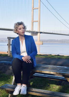 Author Louise Beech / Swanson sitting on a bench