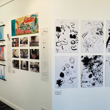 Photo of Mansfield Central Library gallery walls with children's artwork and photographs on display