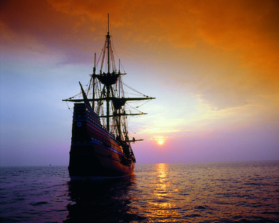 Mayflower voyage at sea with sunset in background