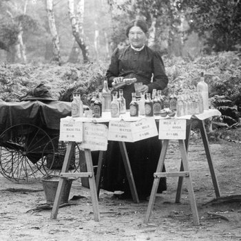 Black and white image of a lady called Mrs Robinson selling drinks from a cart