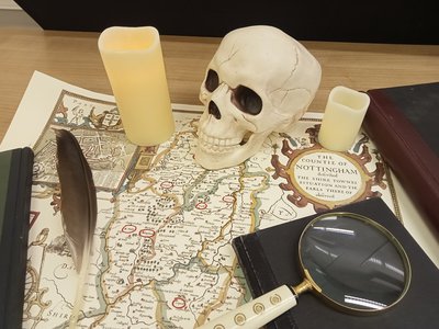 Map of Nottinghamshire with a skull and candles
