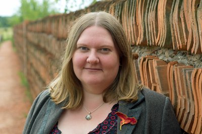 Photo of author Nell Pattison - a white woman with light brown hair, wearing a grey jacket.