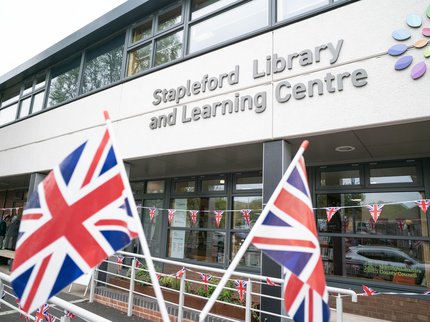 Exterior of Stapleford Library, with flags to celebrate VE Day