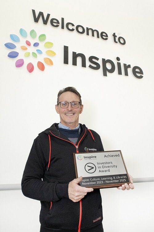 Peter Gaw smiles as Inspire are presented with accreditation for achieving Investors in Diversity.