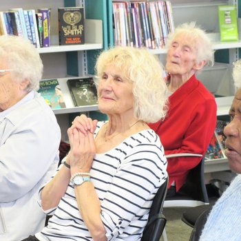 Women listening to Sing with Friends session
