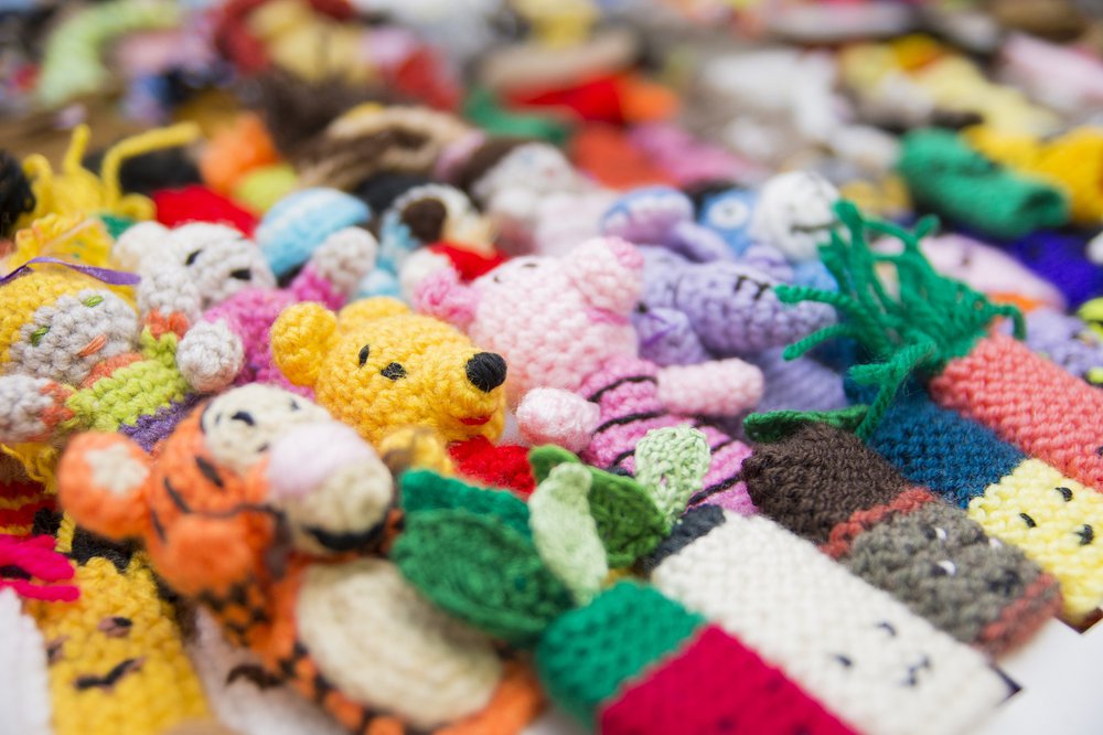 A collection of finger puppets made from wool
