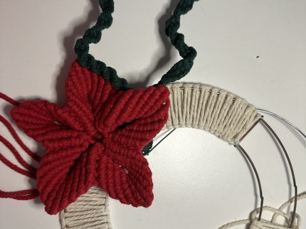 Metal macrame hoop with red Christmas flower