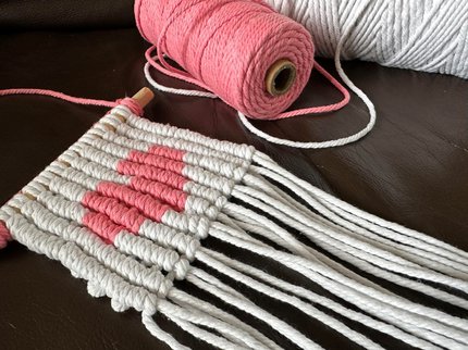 Macrame knitting with image of pixel heart