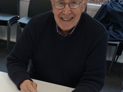 Older male learner with a smartphone