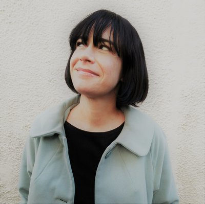 A headshot of Susannah Lloyd - author of Badgers are Go! She is a white woman with a dark brown bob hairstyle.