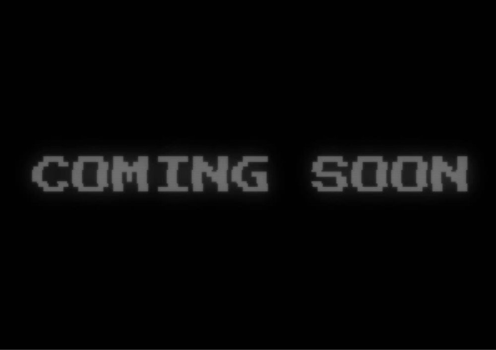 Black screen with the words 'coming soon' written in grey text.
