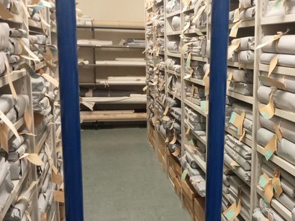 Archives storage shelves with blue bars across image