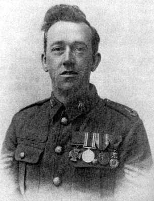 A black and white image of William Henry Johnson in uniform, wearing his military medals.