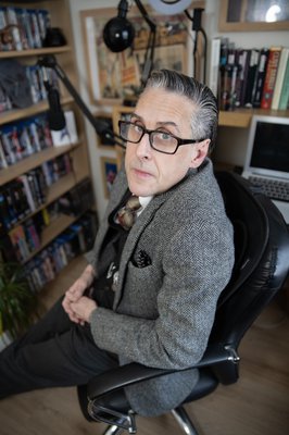 Photograph of Andrew Graves seated in an office.