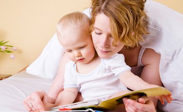 baby and parent reading book.jpg