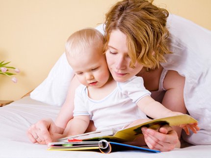baby and parent reading book.jpg