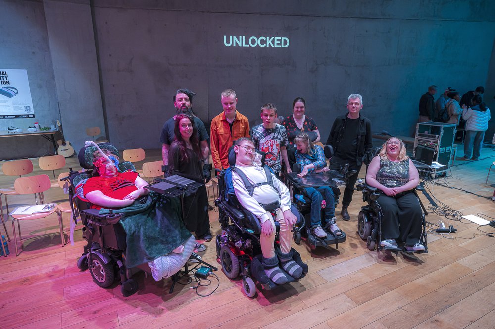 Group photo of the AO Pioneers and their mentors at the Unlocked showcase event.