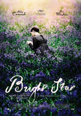Bright Star Film poster.  A woman in 19th century period dress reading a letter in a field of flowers