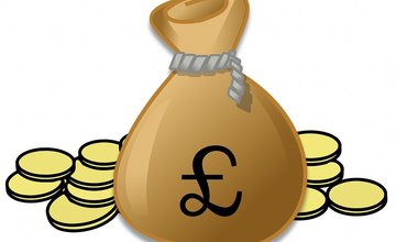 Closed gold bag with pound symbol closed with string and gold coins at the side