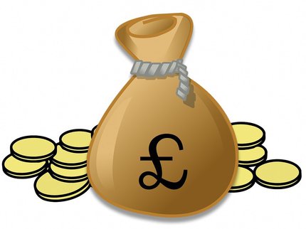 Closed gold bag with pound symbol closed with string and gold coins at the side