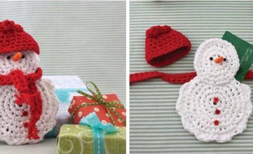 White, crochet snowman with red had and scarf