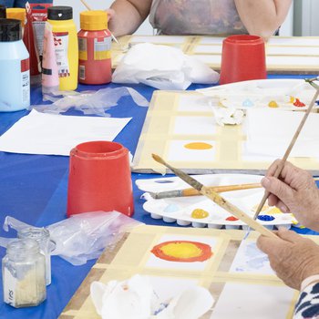 Painting postcards in a workshop