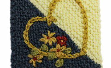 Embroidered flowers and a chain stitch heart on a Care Square