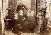 black and white photo of a victorian family a mum dad and three daughters