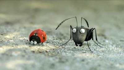 An animated ant and ladybird walking on the ground.  They both have large white eyes