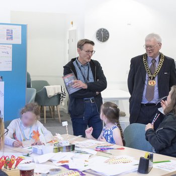 Peter Gaw chatting with children and parents