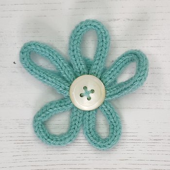 I-cord flower with a white button centre