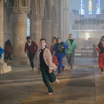 People running through a church building