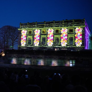 Colourful flowers projected on to Nottingham Castle