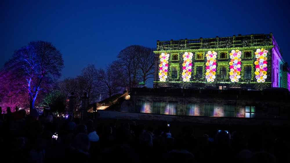 Nottingham castle with a digital projection of flowers
