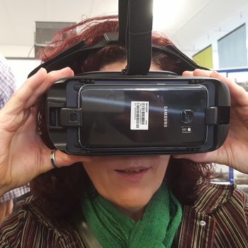 Image of a visitor to the Local History Fair wearing virtual reality googles to take a virtual trip down the coal mine