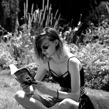 Photograph of a young woman reading