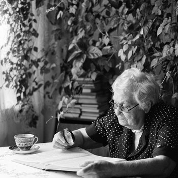 Photograph of an elderly woman reading