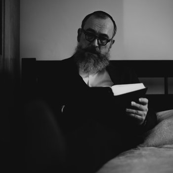 Photograph of a man reading